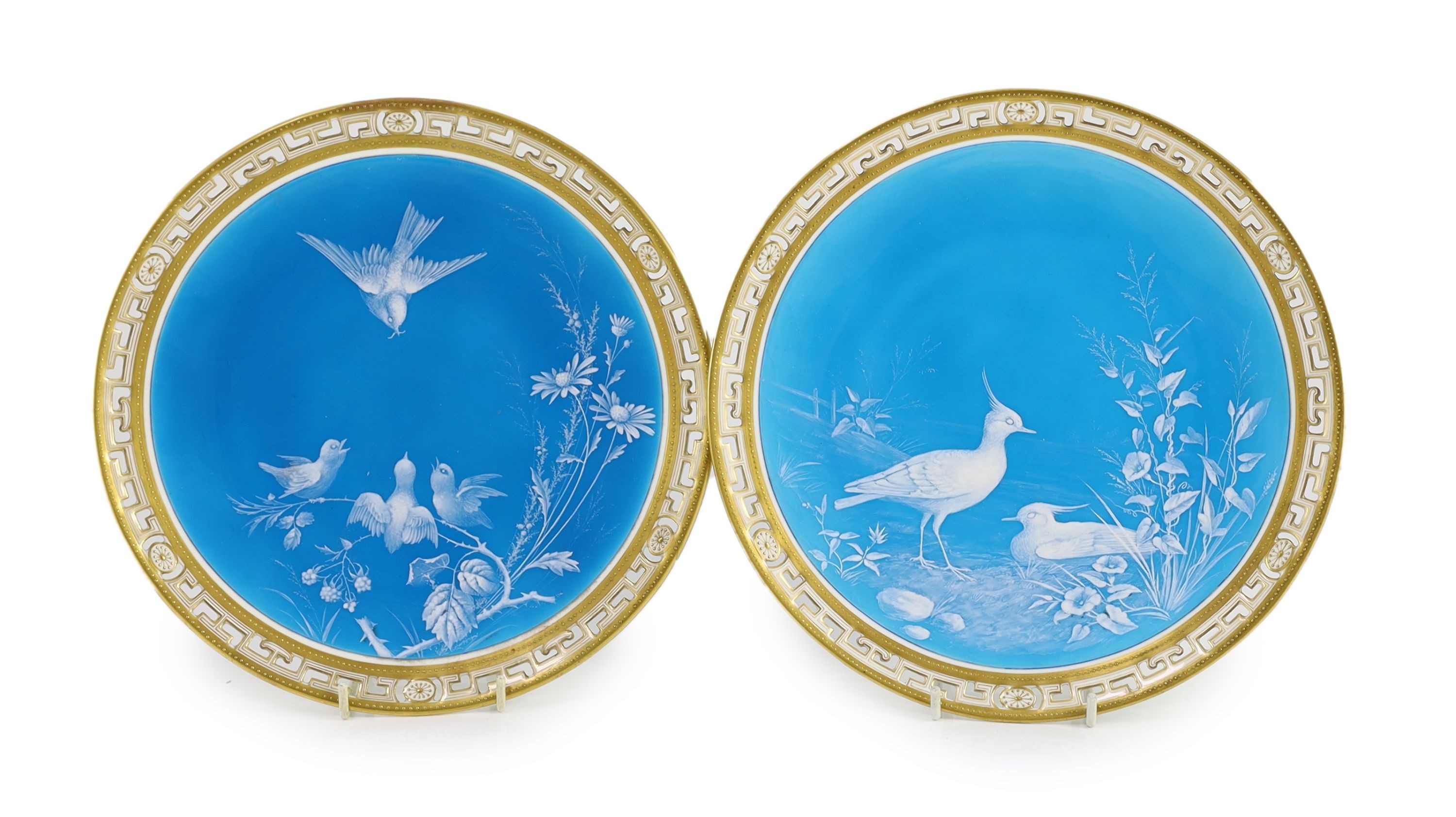 A pair of Minton ‘Limoges enamel’ cabinet plates, attributed to Desire Leroy, c.1877, 24cm diameter, One plate with small section of rim broken and glued